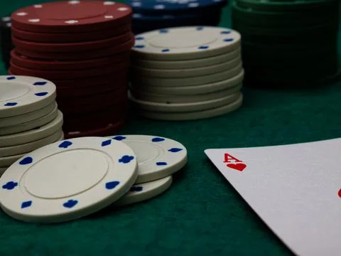 Poker game table, single ace card score with stack of playing chips Stock Photos