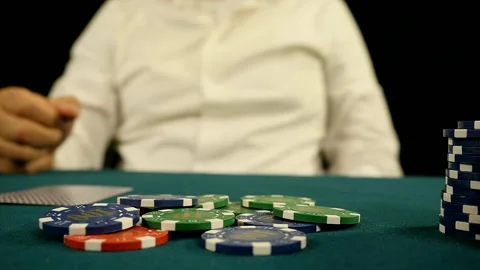 Poker player betting while playing Texas Holdem in casino Stock-Footage 221420042