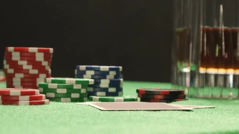 Poker player checking his hand, holding Queen and King combination chips cards Stock Footage 126006975