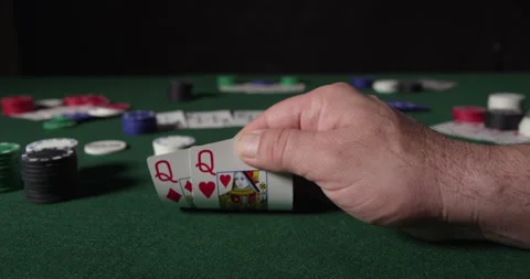 Poker Player Considers His Move with two Queens Stock Footage 243253176