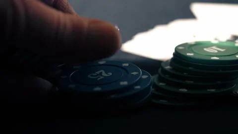 Poker player counting chips Stock Footage 308928499
