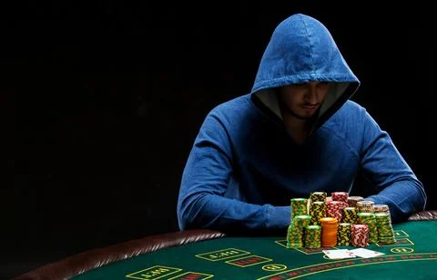 Poker player looking at combination of two aces. Closeup Stock Photos