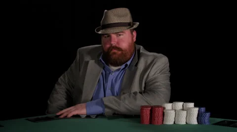 Poker player looks at camera with intimidating expressions Stock Footage 53236772