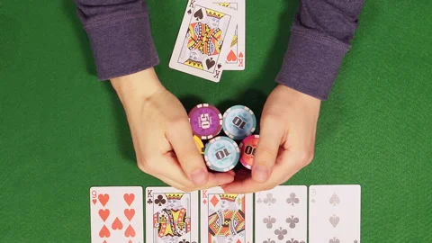 POKER: Player opens his cards and takes an all chips (top view) Stock Footage 143885195