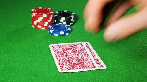 Poker player with pocket pair of jacks looks at his cards. Stock Footage 58742274