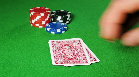 Poker player with pocket pair of jacks looks at his cards. Stock Footage 58742823