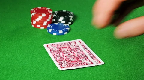Poker player with pocket pair of jacks looks at his cards. Stock Footage 58742934