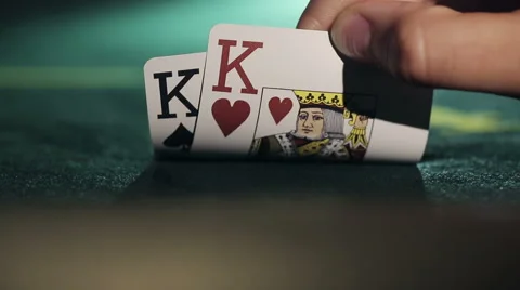Poker player shows his pair hand two kings Stock Footage 53607030