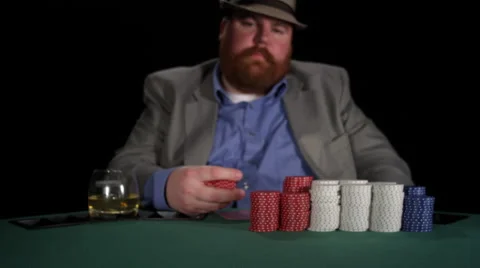 Poker player splashes chips into the pot from side to side close to the camera Stock Footage 53243871