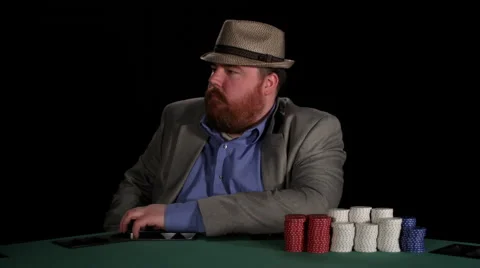 Poker player stares at camera with intimidating expressions Stock Footage 53237079