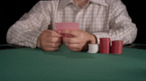 Poker player throws down an ace and jack on the table Stock Footage 53244154
