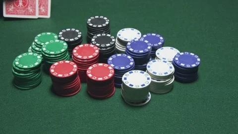 Poker Player Winning on a green table Stock Footage 243611904