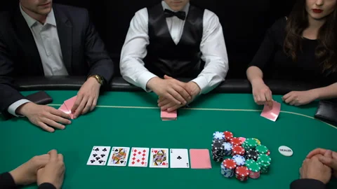 poker-players-putting-dollars-and-footage-093413804_iconl.jpeg