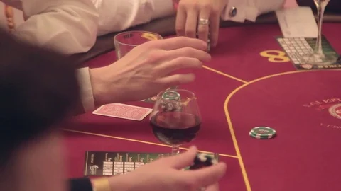 Poker players at the table make bets. In the frame only the table and hands Stock Footage 77910278