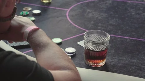 Poker table during a game close-up. Player Chips and cards on the table. Casino Stock Footage 247279211