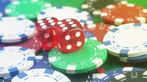 Poker Table With Poker Chips Turns In Casino. Many Poker Chips Spins on the Stock Footage 284228113