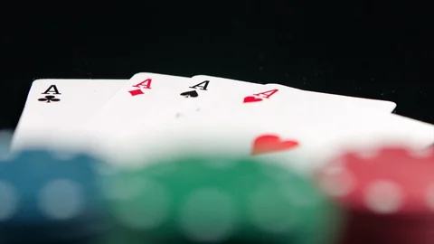 Poker winning chips and four aces on the black background Stock Footage 94059514