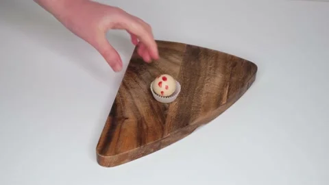 Pokes candy with a spatula 스톡 동영상 131111108