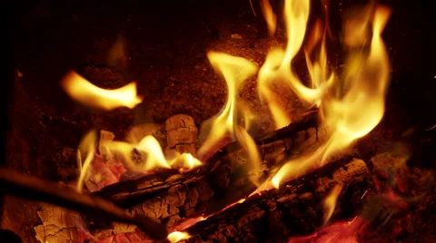 Poking the fireplace in the evening Video stock 42255590