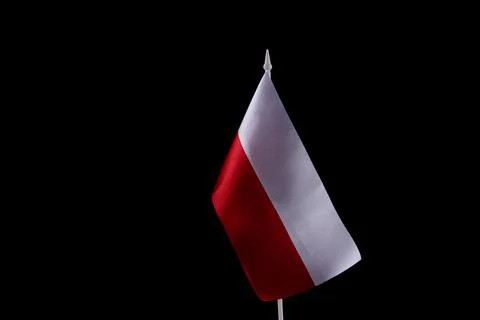 Poland flag on the dark background. Copy space. Stock Photos