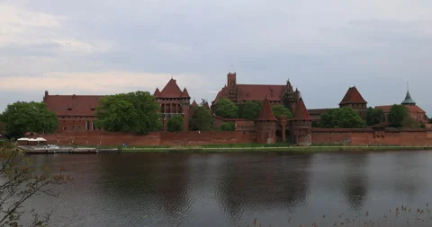 Poland Malbork Castle across river to building 4K Stock Footage 334979794