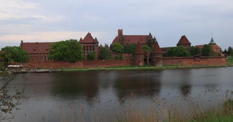Poland Malbork Castle across river to wall 4K Stock Footage 334979885
