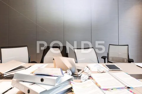 Poland, Warsaw, Papers, Mini Tablet, Laptops And Folders On Conference Table At