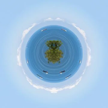 Polar coordinates, a circular image of the blue sea, clouds above the horizon Photos