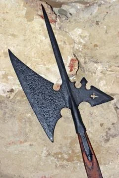 Pole axe spear infront the medieval castle wall Stock Photos