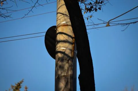 A pole with a black hat on top of it.  Stock Photos