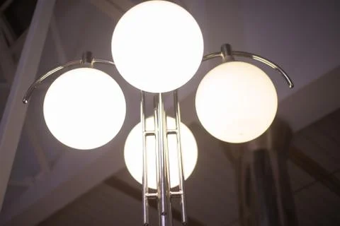 Pole with burning lanterns in the interior Stock Photos