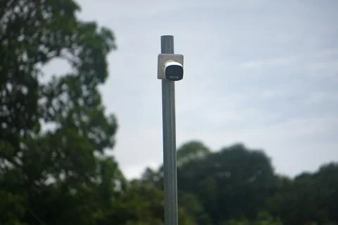 A pole with a camera on top of it Fotos de archivo