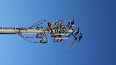 Pole connected with high-voltage wires vertical videos Stock Footage 262389602