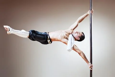 Pole dance man Stock Photos