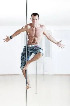 Pole dance man Stock Photos