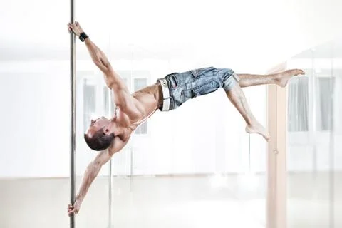 Pole dance man Stock Photos