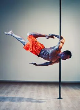 Pole dance man Stock Photos