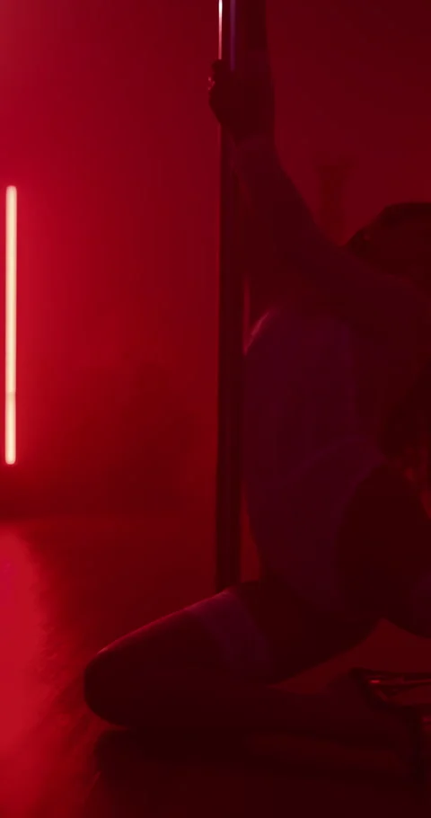Pole dancer, woman and dance with neon light on stage for exotic performance Stock Footage 307577827