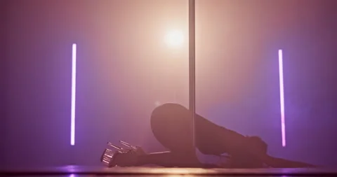 Pole dancing, dancer and silhouette of woman in club for performance, talent and Stock Footage 306123006