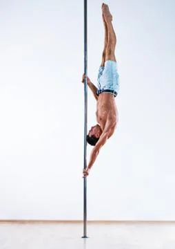 Pole dancing man Stock Photos
