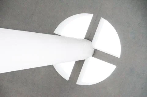 Pole leading to circular sky light divided into four even pieces under a grai Stock Photos