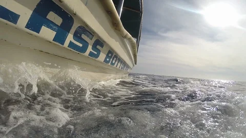 Pole mount camera submerged in ocean from side of glass bottom boat Video stock 120368316