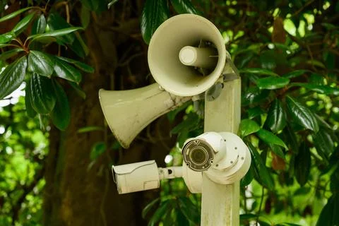 Pole-mounted security and warning system, video cameras, and speakers in public Stock Photos