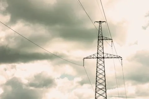 Pole with power line and insulators against Stock Photos