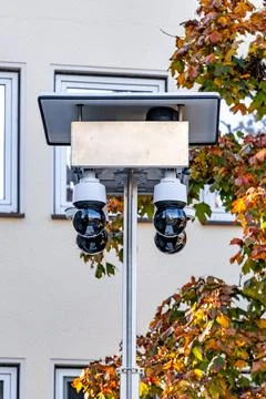 A pole with three cameras on it Stock Photos