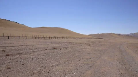 Poles with barbed wire on the border between the states Stock Footage 50253621