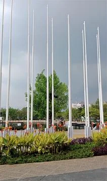 Poles lined up in the park Stock Photos