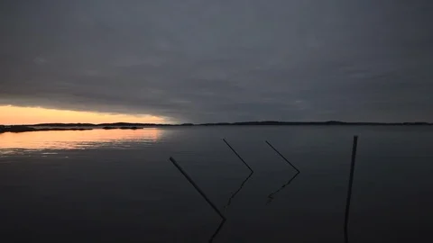 Poles in sea at sunset Stock Footage 85921701