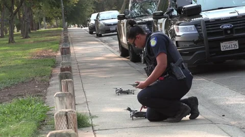 Police Action, new technology, woman preparing drone Stock Footage 159621021