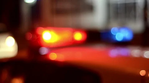Police, ambulance and firetrucks emergency lights flash at night. Crime scene Stock Footage